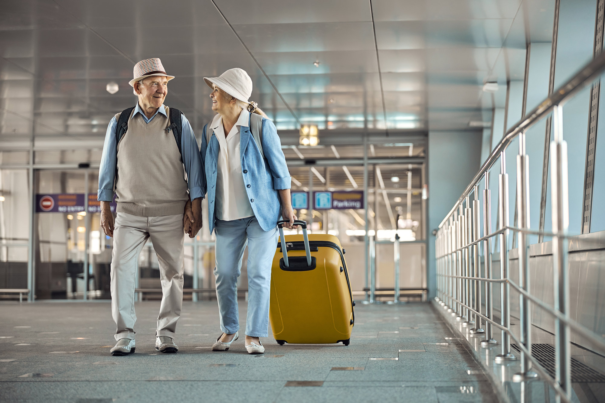 seniors walking in an airport